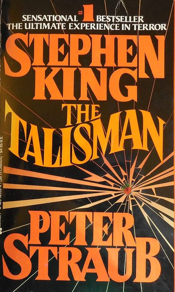 book cover, black with impact shattered glass, orange writing, Stephen King The Talisman Peter Straub.